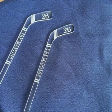 video showing three hockey themed stir sticks
